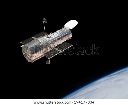 The Hubble Space Telescope in orbit above the Earth. Elements of this image furnished by NASA.  Royalty-Free Stock Photo #194177834