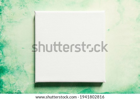 Close-up of canvas for painting on grunge background