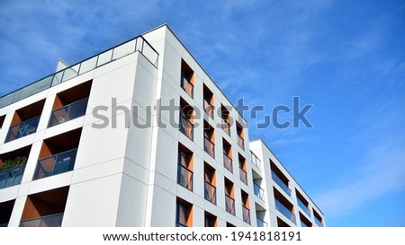 Part of city real estate property and condo architecture. Detail in modern residential flat apartment building exterior. Fragment of New luxury house and home complex. 