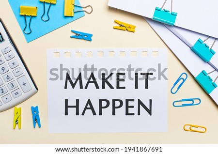 On a light background, there are stacks of documents, a white calculator, yellow and blue paper clips and clothespins, and a notebook with the text MAKE IT HAPPEN