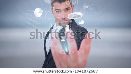 Composition of network of digital icons and statistics over hand of businessman. global technology and digital interface concept digitally generated image.