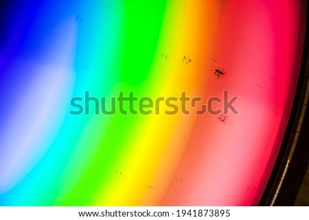 dust on a CD from close up, Macro photo about a compact disk, Rainbow at home