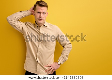 let s me think. man doubts his decision, isolated over yellow background