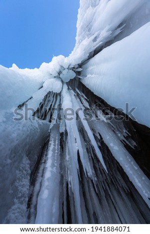 Icicles in the rocky caves. Winter at Lake Baikal