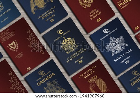 Top View, International Passports, citizenship  by Investment, Nationality, Malta, Citizens of Kitts and Nevis, Portugal, Cyprus, Dominica, Montenegro, Saint Lucia, Grenada Royalty-Free Stock Photo #1941907960