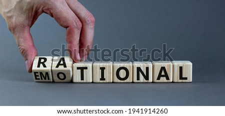 Rational or emotional symbol. Psychologist turns wooden cubes and changed the word 'rational' to 'emotional'. Beautiful grey background. Psychological and rational or emotional concept. Copy space. Royalty-Free Stock Photo #1941914260