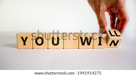 You will win symbol. Businessman turns cubes and changes words you will to you win. Beautiful white background, copy space. Business, motivational and you will win concept. Royalty-Free Stock Photo #1941914275