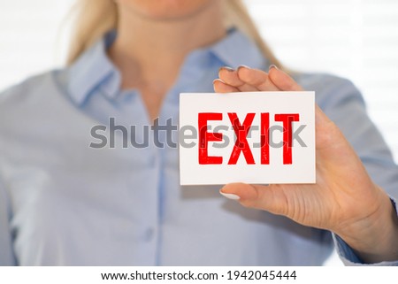 Exit sign label on wooden board.