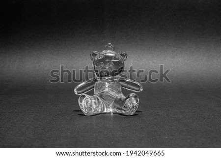 glass bear on a black background