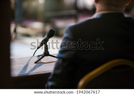 man giving statement in court during interrogation Royalty-Free Stock Photo #1942067617
