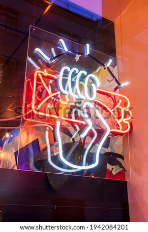 neon sign shawarma hand kebab glowing billboard window street
