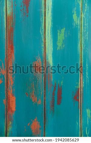 Boards painted with a brush in aqua color. Wooden background in rustic style on green color. Brown wood plank wall texture background. Vertical photo for social media. Copyspace. Retro concept