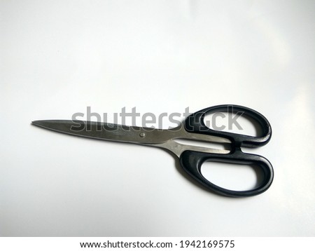 A Sharp Scissor On The White Bacground