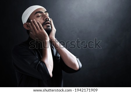 Religious asian muslim man praying