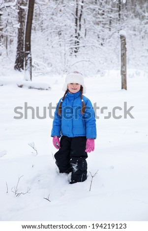 wonderful girl child in the snowy woods