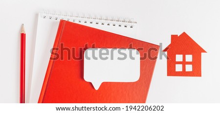 Sweet home. Estimating and paying house tax. Mock up with red house, notepad and sticker in copy space white background