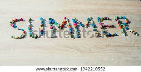 word summer made of colored stones