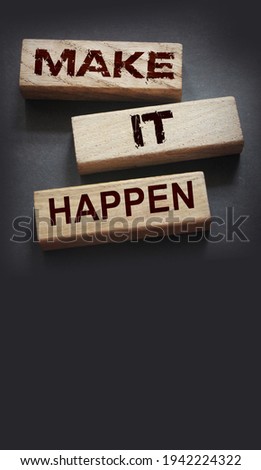 Make It Happen written on a wooden blocks. Motivation coaching career and business concept.