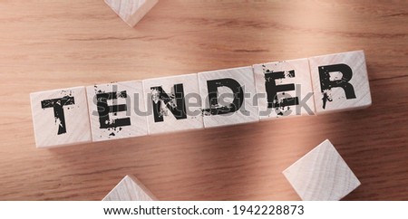 Tender Word Written In Wooden Cubes. Business concept.