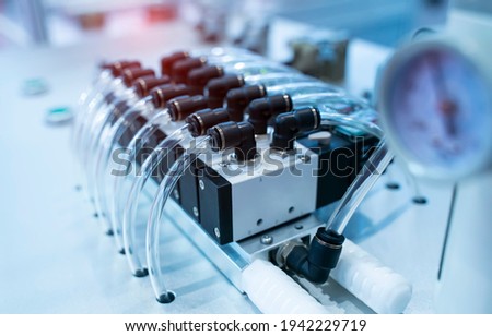 robotic pneumatic piston sucker unit on industrial machine,automation compressed air factory production Royalty-Free Stock Photo #1942229719
