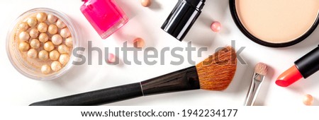 Make-up panoramic banner. Various makeup products and tools, shot from the top