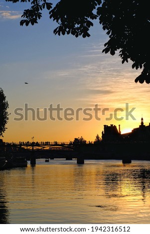 Beautiful orange sunset at the river Seine in Paris France 