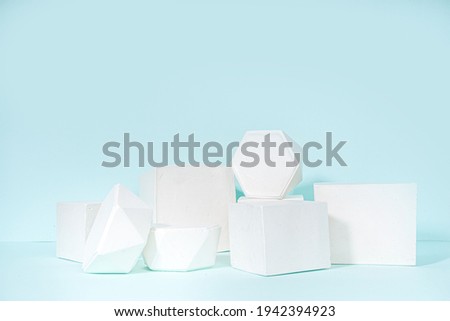 Modern Minimal Mockup Display White Set Geometry Pedestal Stand Podiums On Blue Background 