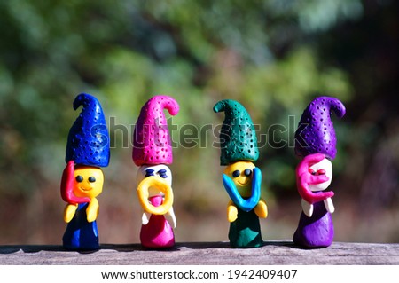 Figurines of colored dwarfs made of plasticine.