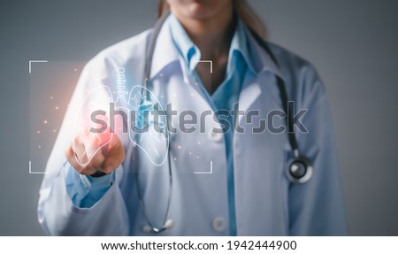 Doctor diagnose virtual human lungs innovation and medical technology. Healthcare and medicine concept. Royalty-Free Stock Photo #1942444900