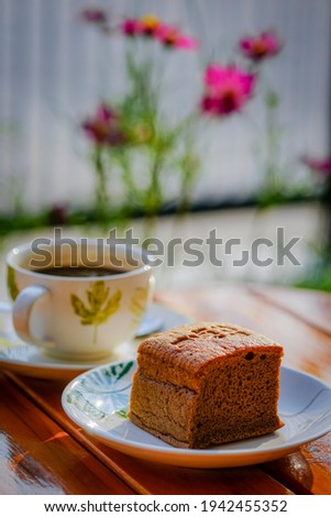 Coffee cake and hot coffee in the flower garden, refreshing in the morning