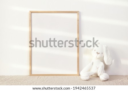Nursery photo frame mockup with white bunny