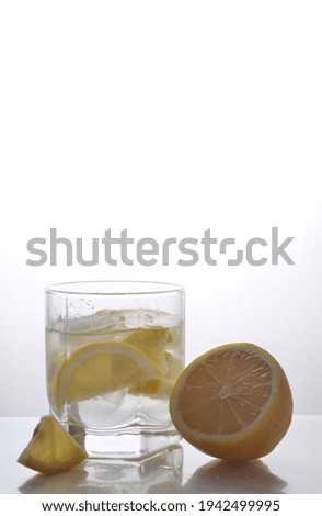 Lemon and water on a white background