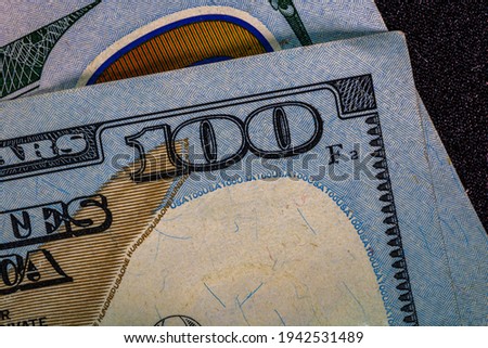 Selective focus on detail of 100 dollars banknote. Close up macro detail of money banknotes, dollars isolated.