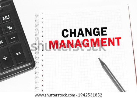 Text CHANGE MANAGMENT on paper card, Pencils on table - business, banking, finance and investment concept.