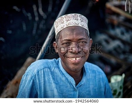 Senior man sitting on coast smiling nice with hat , High quality photo Royalty-Free Stock Photo #1942564060