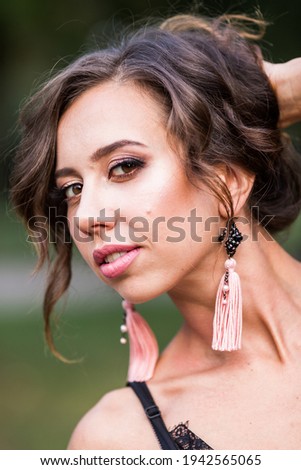 Portrait of a model with dark hair close-up.