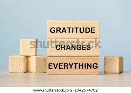 GRATITUDE CHANGES EVERYTHING. The text is on the light cubes. Bright solution for business, financial, marketing concept