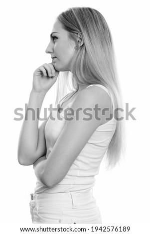 Profile view of young beautiful teenage girl thinking