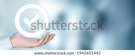 Standard quality control certification assurance guarantee in hand Royalty-Free Stock Photo #1942601443