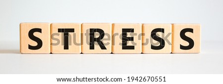 Stop stress and be health symbol. Wooden cubes with the word 'stress'. Beautiful white background. Psychological, business and stop stress concept. Copy space.
