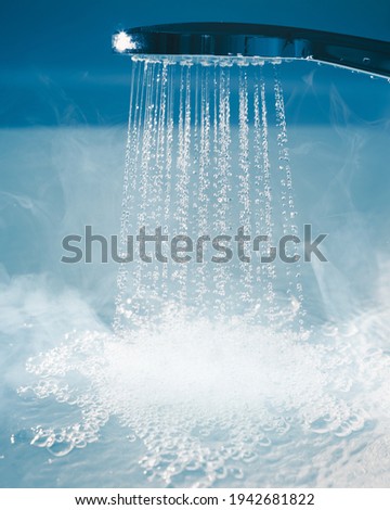 douche with flowing water and steam Royalty-Free Stock Photo #1942681822