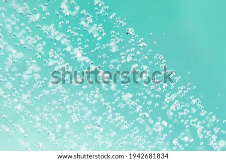 douche water drops, emerald background Royalty-Free Stock Photo #1942681834