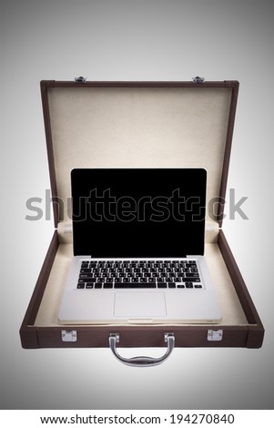 Laptop in briefcase isolated on white background (vignette filtered process)