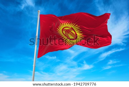 Large Kyrgyzstan flag waving in the wind