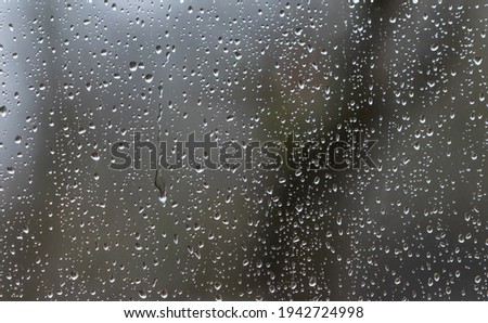 raindrops pouring  on the window