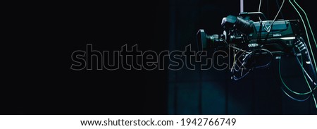 Video camera on a concert stage studio.video cinema in studio.Movie production.Action, theatre day.Director, film industry, 4k 8k camera.Video live streaming. Broadcast television.event film.Producer