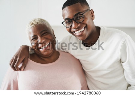 Happy mother and son hugging each other at home - Focus on boy face Royalty-Free Stock Photo #1942780060
