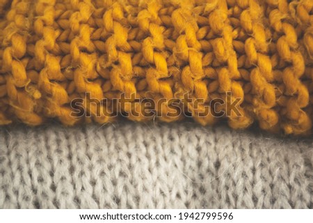 Vintage folded clothes closeup. Sweater weather cinematic background. Calm cozy hygge concept.