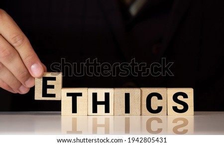 ETHICS word on wooden cubes.