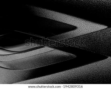 Plastic detail resembling futuristic architecture fragment, modern building interior or exterior, industrial or technological background with sharp brackets. Abstract minimalist design composition.